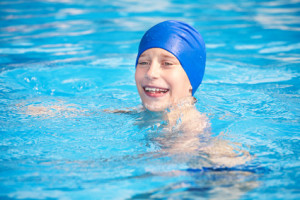 swimmer cap in pool laughing